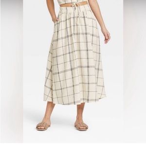 A New Day long skirt. Size Medium. New with tags. Cream and dark grey plaid